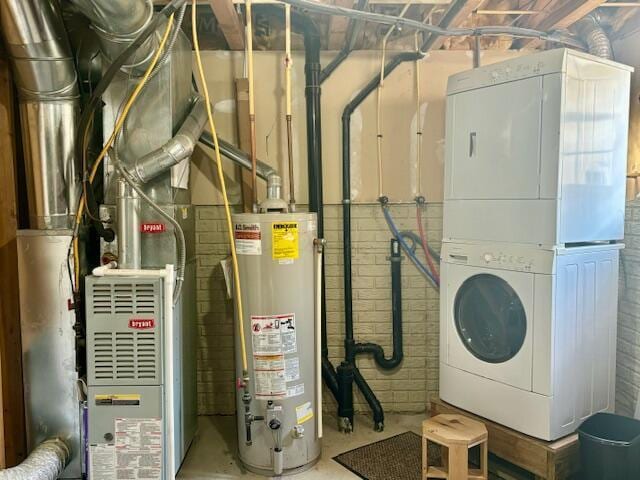 utilities with gas water heater and stacked washer and clothes dryer