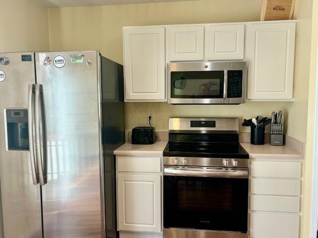 kitchen with white cabinets and stainless steel appliances