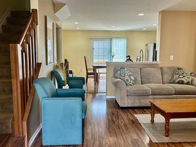 living room featuring dark hardwood / wood-style floors