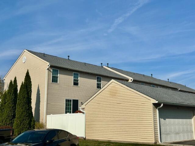 view of property exterior with a garage