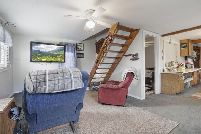 living room with ceiling fan and light carpet