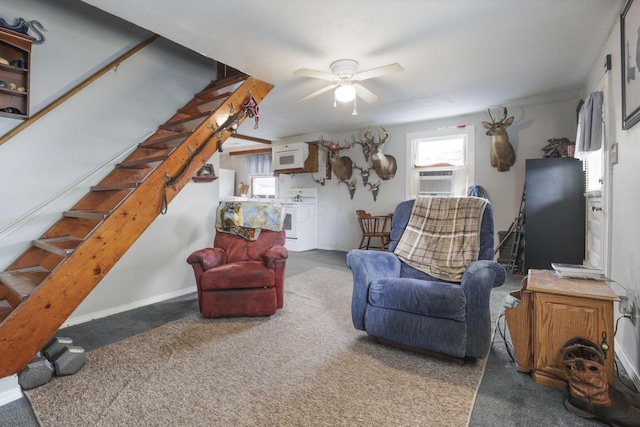 living room with ceiling fan and dark carpet