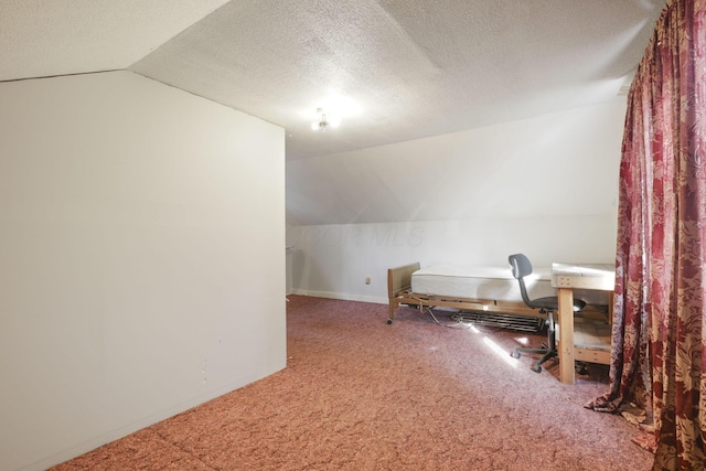 bonus room with a textured ceiling, carpet floors, and vaulted ceiling