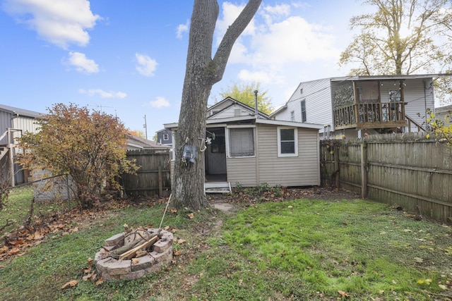 view of yard with an outdoor fire pit