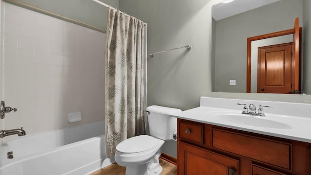 full bathroom with shower / tub combo with curtain, vanity, and toilet