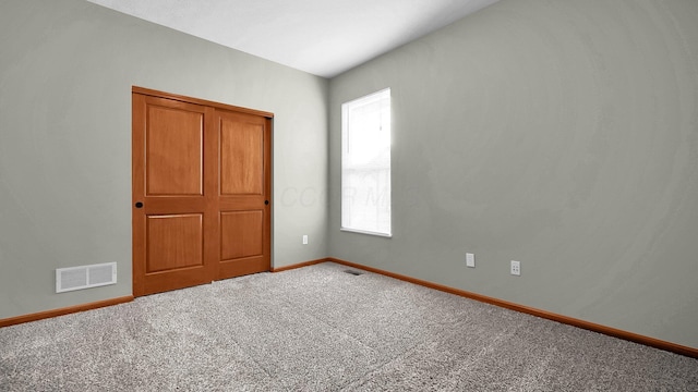 unfurnished bedroom with carpet floors