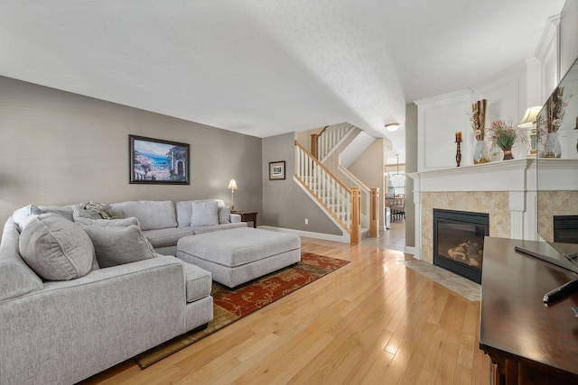 living room featuring a fireplace and light hardwood / wood-style flooring