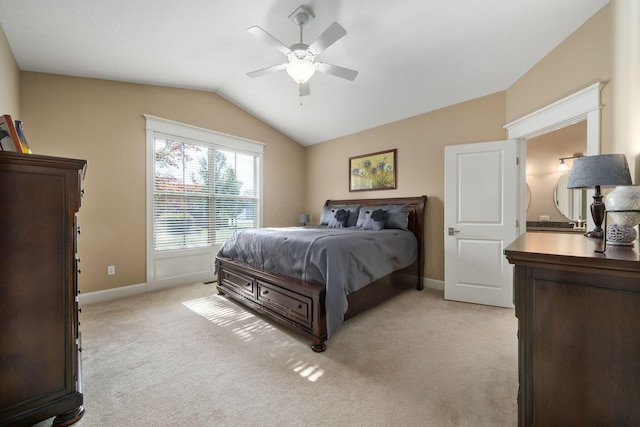 bedroom featuring ceiling fan, light carpet, and lofted ceiling