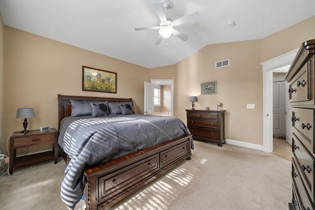 bedroom featuring ceiling fan, lofted ceiling, and light carpet