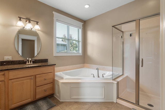 bathroom featuring vanity, tile patterned floors, and independent shower and bath