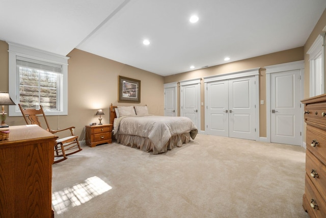 bedroom with light colored carpet