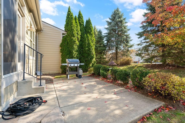 view of patio featuring a grill