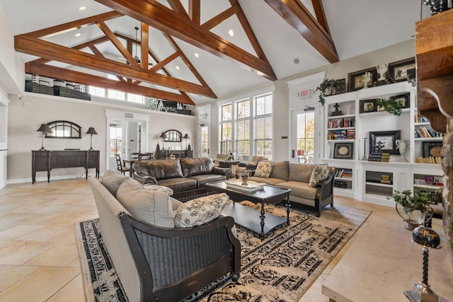 living room with beamed ceiling and high vaulted ceiling