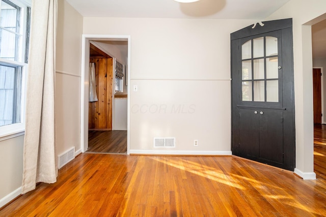 interior space with hardwood / wood-style floors and plenty of natural light