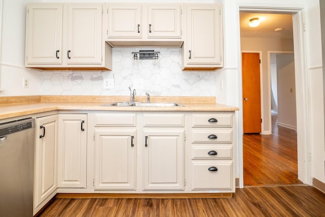 kitchen with dishwasher, dark hardwood / wood-style floors, sink, and tasteful backsplash