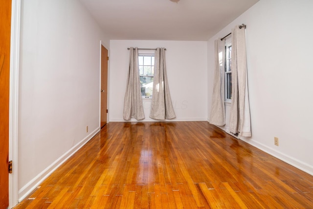 spare room with wood-type flooring