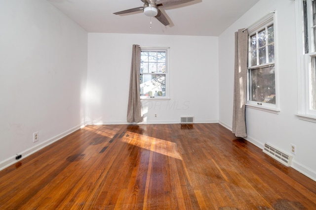 empty room featuring dark hardwood / wood-style floors and ceiling fan