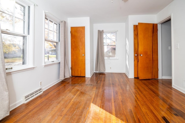 spare room with hardwood / wood-style flooring