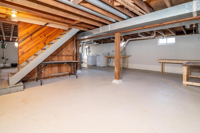 basement with washing machine and dryer and gas water heater