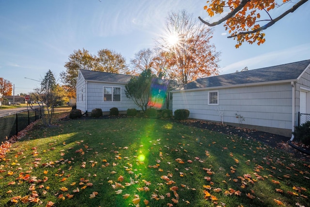 rear view of property with a yard