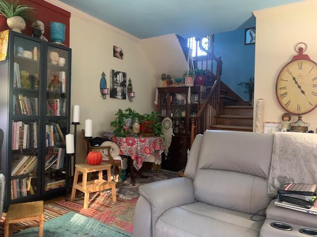 living room with ornamental molding