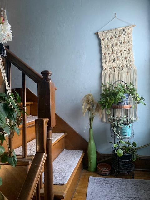 stairs featuring hardwood / wood-style floors