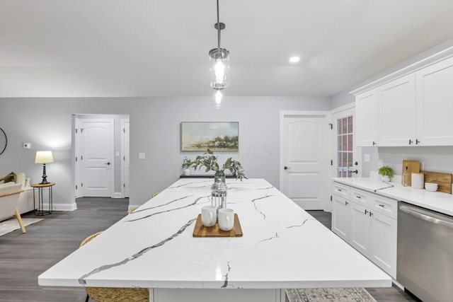 kitchen featuring dark hardwood / wood-style floors, white cabinetry, stainless steel dishwasher, and decorative light fixtures