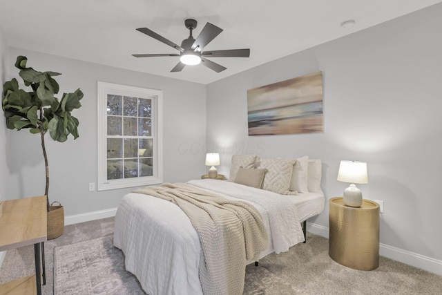 bedroom featuring ceiling fan and light carpet