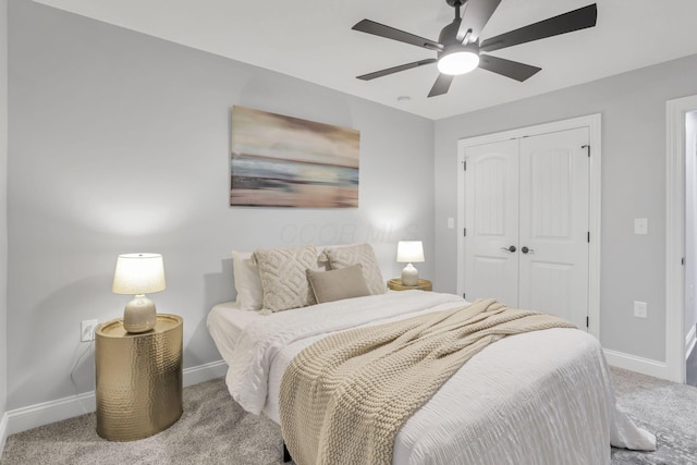 bedroom with ceiling fan, light colored carpet, and a closet