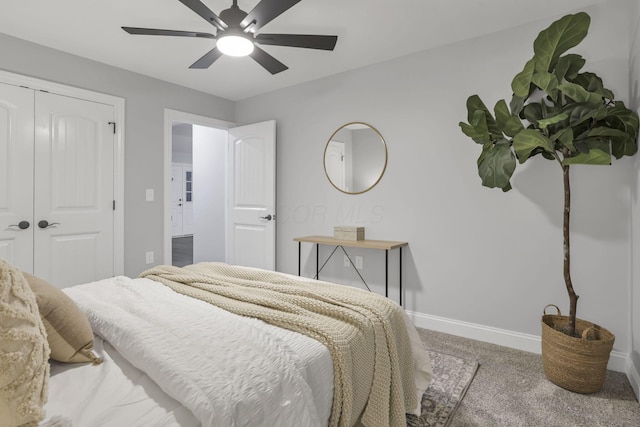 bedroom featuring ceiling fan, a closet, and carpet