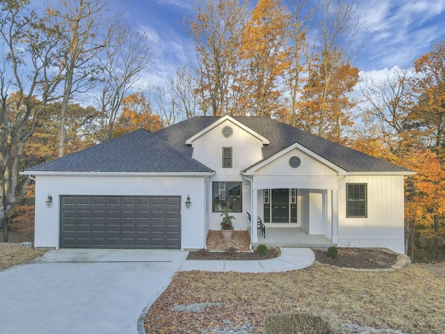 view of front of house with a porch and a garage