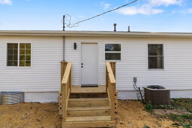 doorway to property with central AC unit