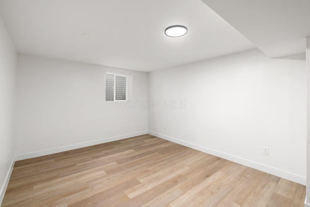 empty room with light hardwood / wood-style floors