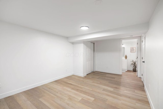 empty room with light hardwood / wood-style flooring