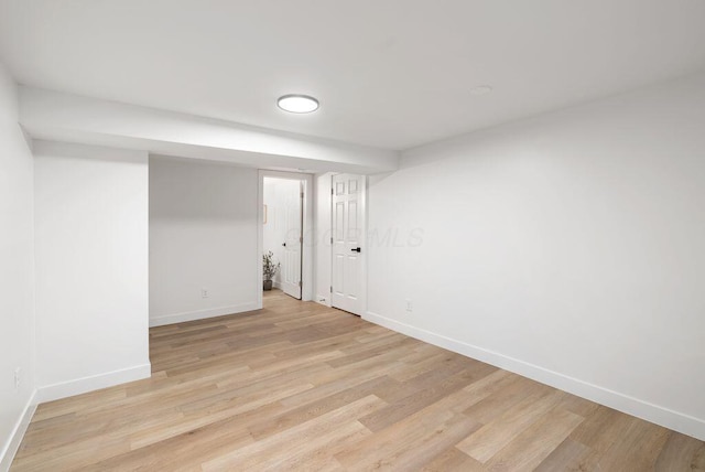 spare room with light hardwood / wood-style flooring