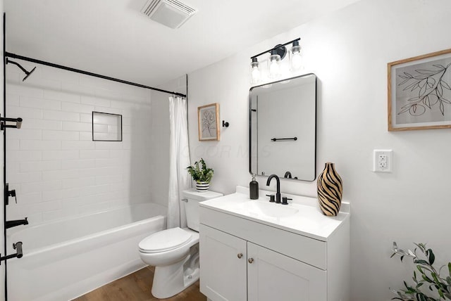 full bathroom with wood-type flooring, vanity, toilet, and shower / bath combination with curtain