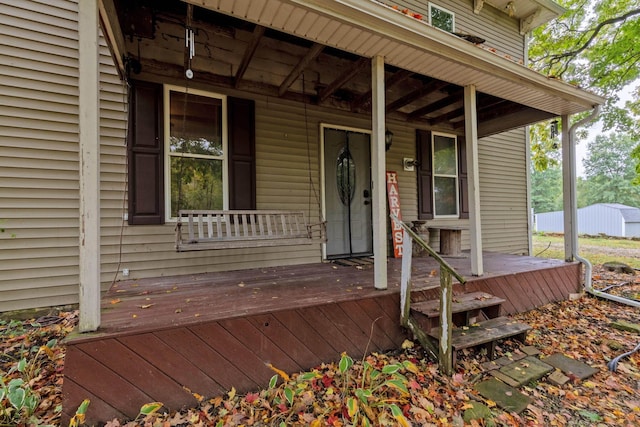 doorway to property with a porch