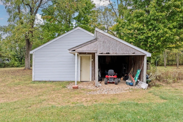 view of outdoor structure featuring a lawn