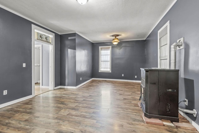 interior space featuring a textured ceiling, dark hardwood / wood-style floors, ceiling fan, and crown molding