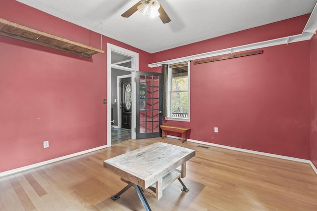 interior space with ceiling fan and light wood-type flooring