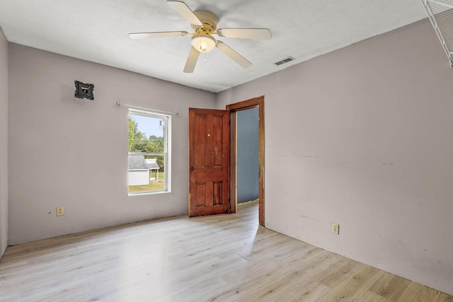 unfurnished room featuring ceiling fan and light hardwood / wood-style floors