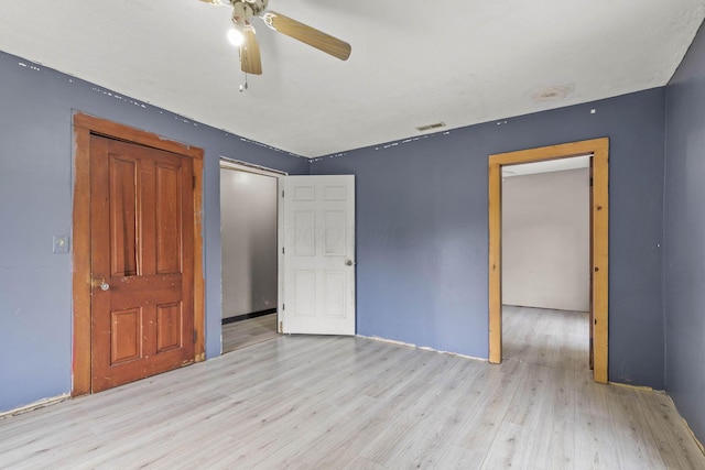 unfurnished bedroom featuring ceiling fan and light hardwood / wood-style flooring