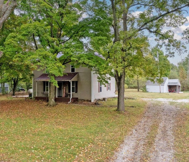 obstructed view of property featuring a front lawn and a porch