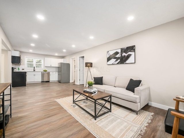 living room with light hardwood / wood-style flooring