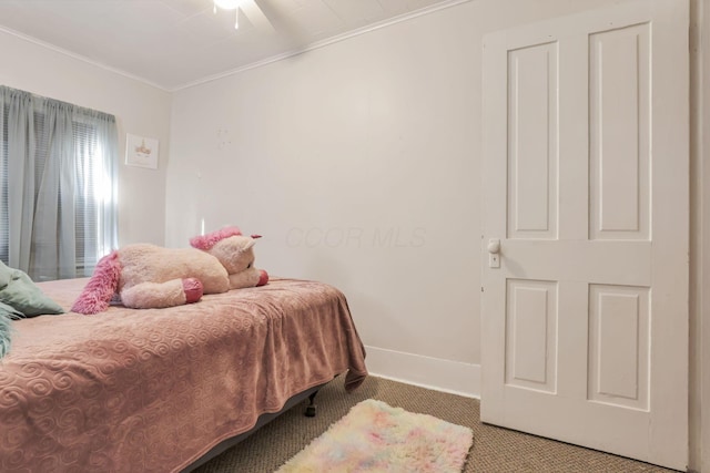 bedroom featuring ornamental molding, carpet flooring, and baseboards