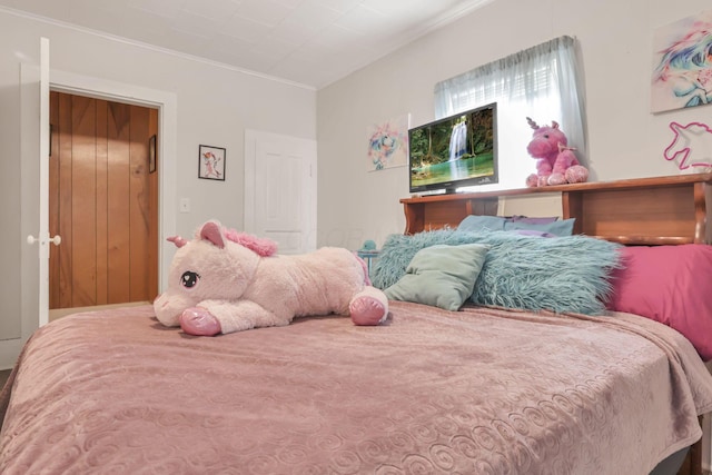 bedroom with ornamental molding