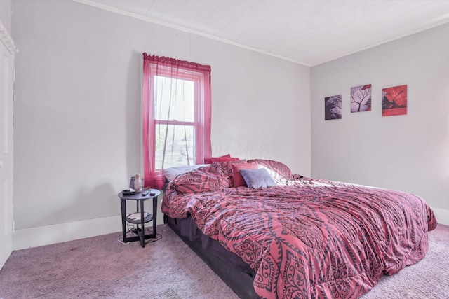 carpeted bedroom featuring ornamental molding