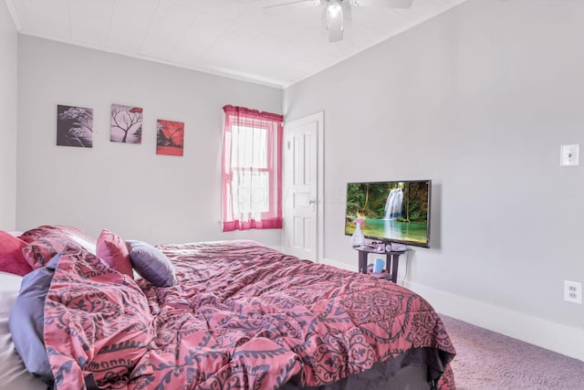 carpeted bedroom featuring a ceiling fan