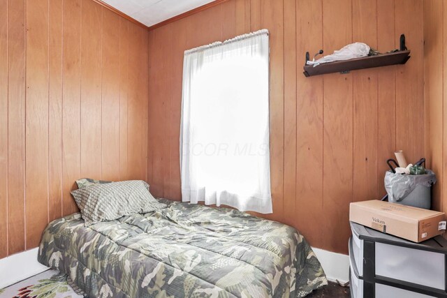 622 S Poplar St, Bucyrus, OH 44820 - bedroom with wooden walls and ornamental molding