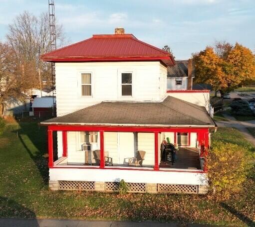 622 S Poplar St, Bucyrus, OH 44820 - rear view of property featuring a chimney and a porch